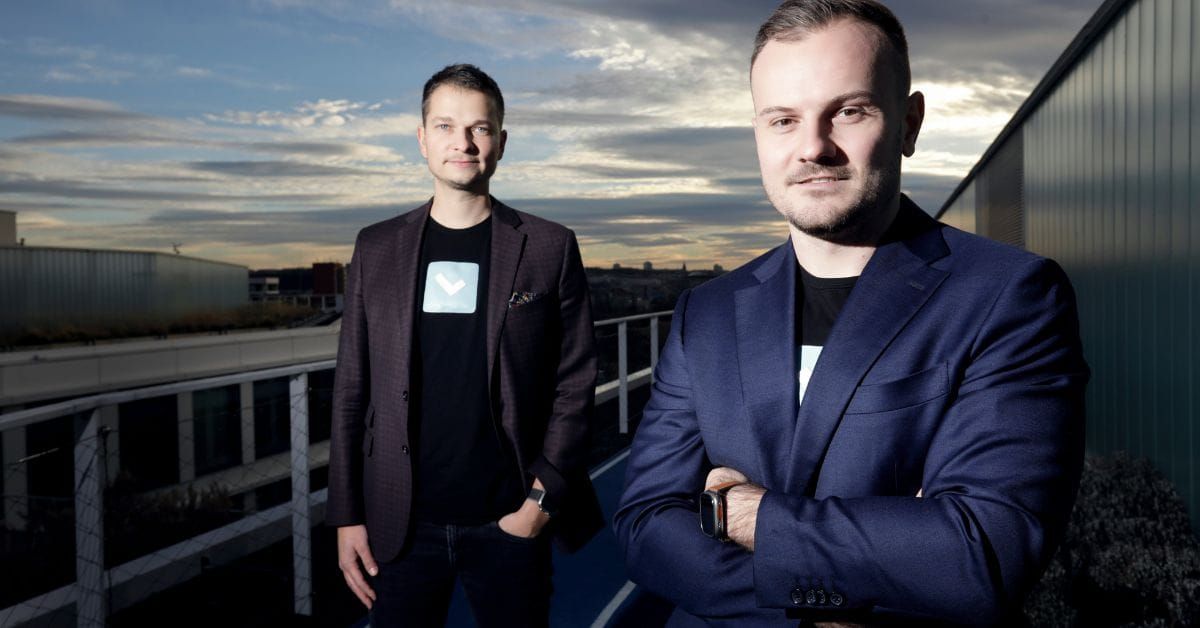 two men posing on a sunset