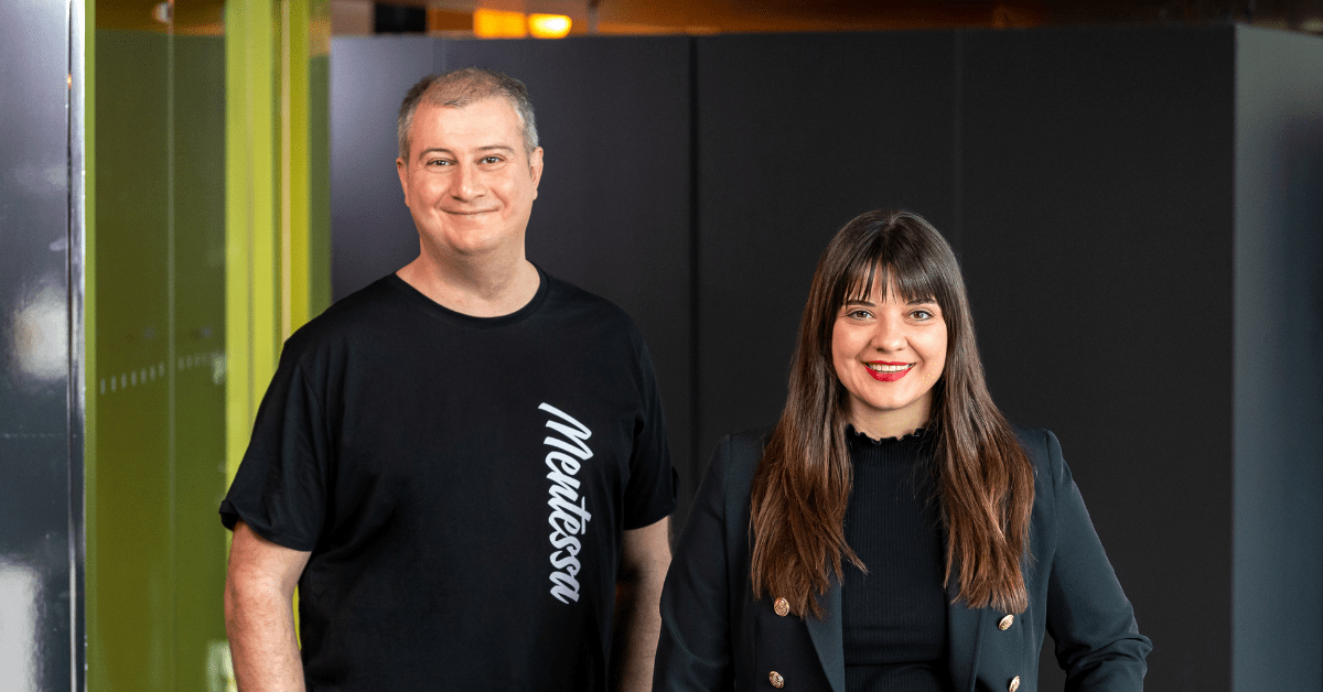 Man and a woman posing for a picture