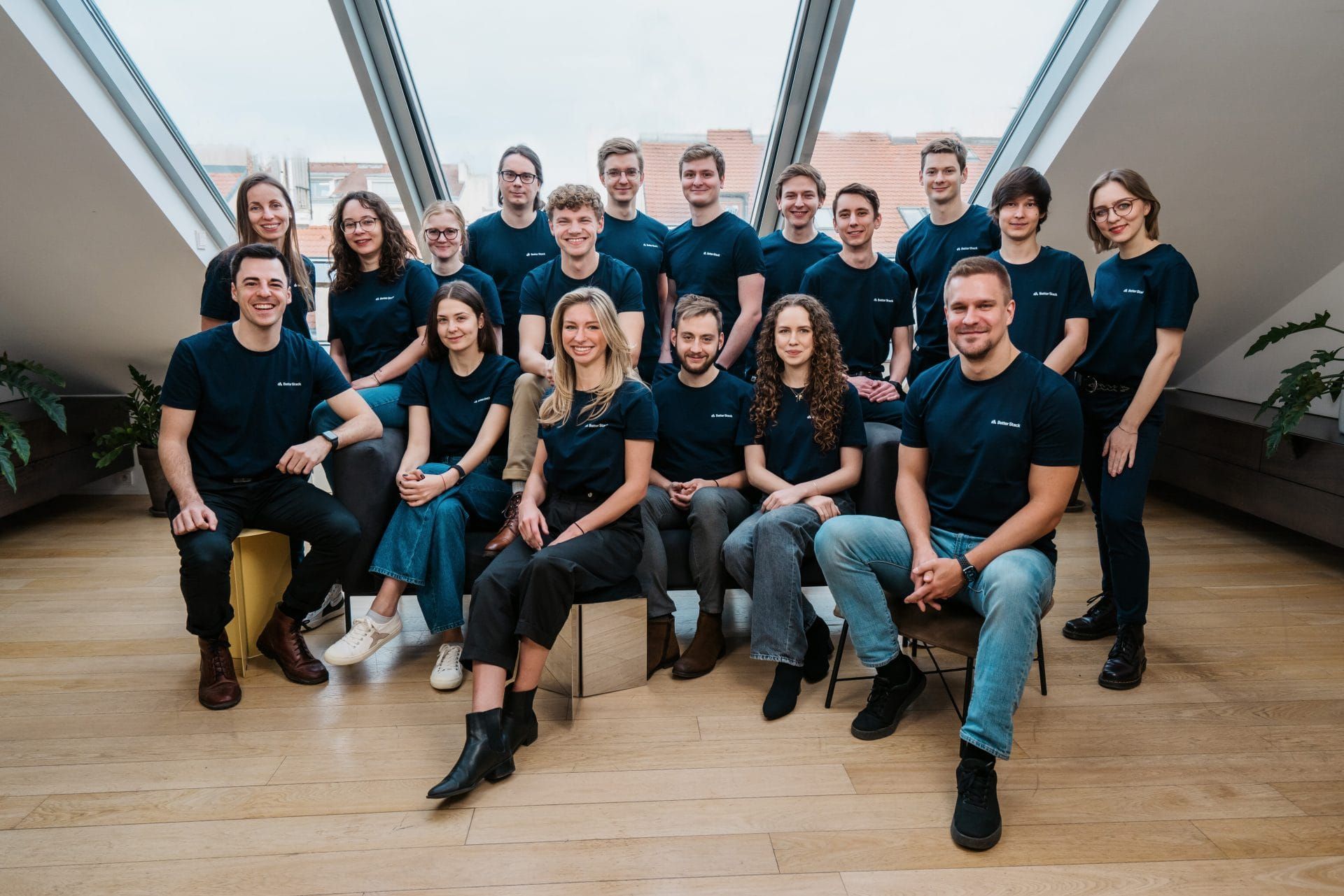 A bunch of men and women posing for a picture