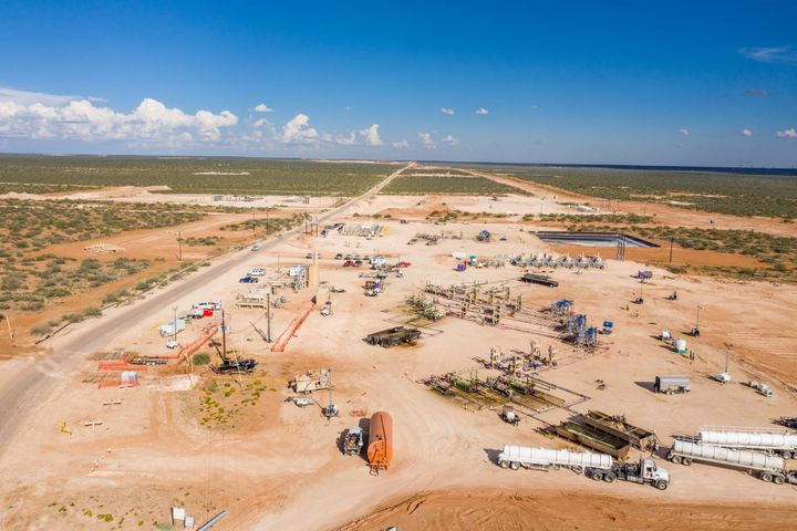 Permian Basin pumpjacks operating at sunset, West Texas oil production