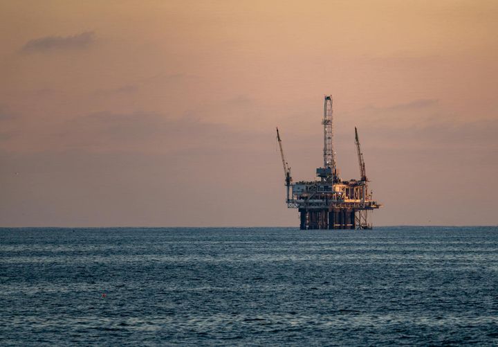 Offshore oil rig at sunset in the Gulf of America