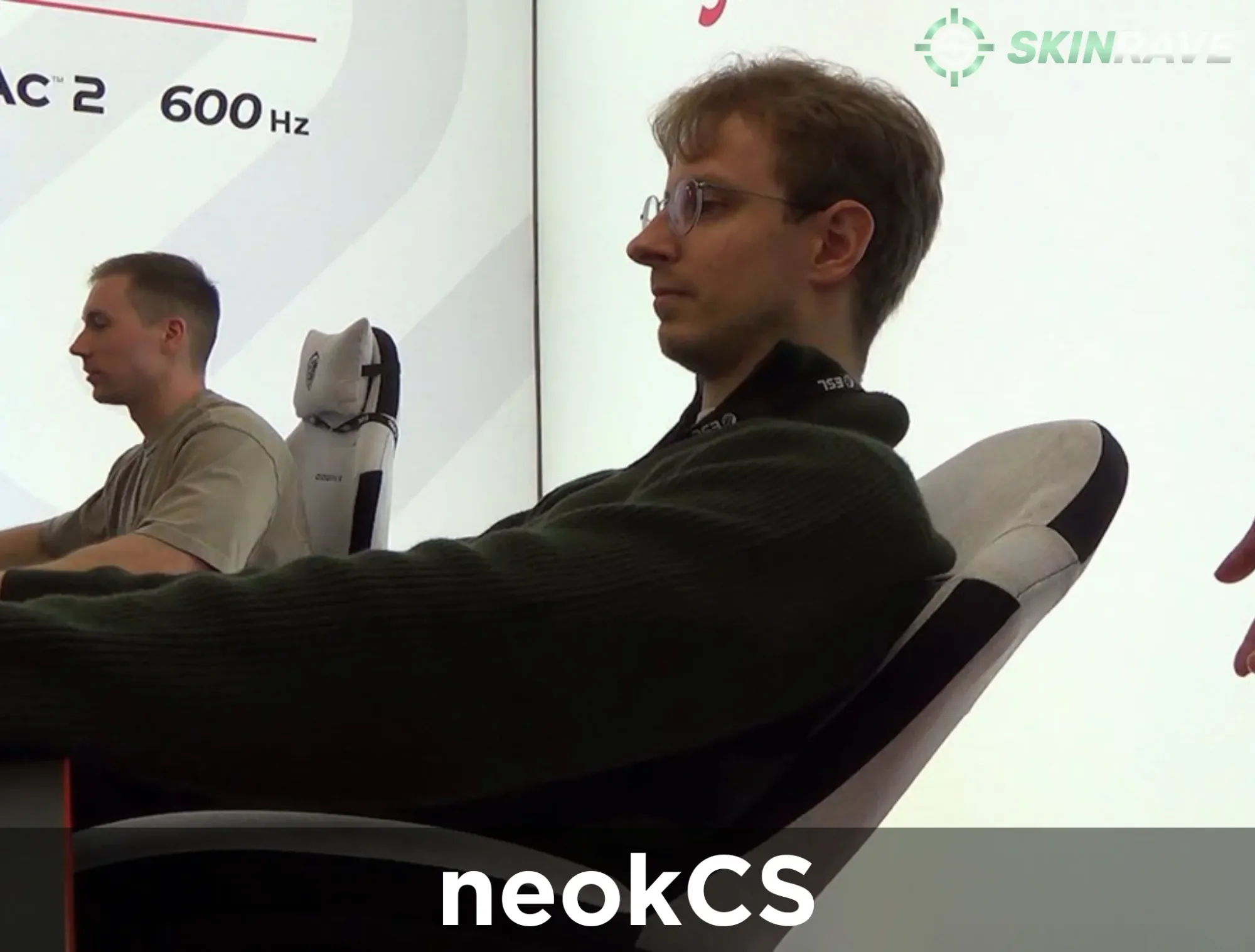 Photo of neokCS sitting on a White Chair playing his favorite game CS2