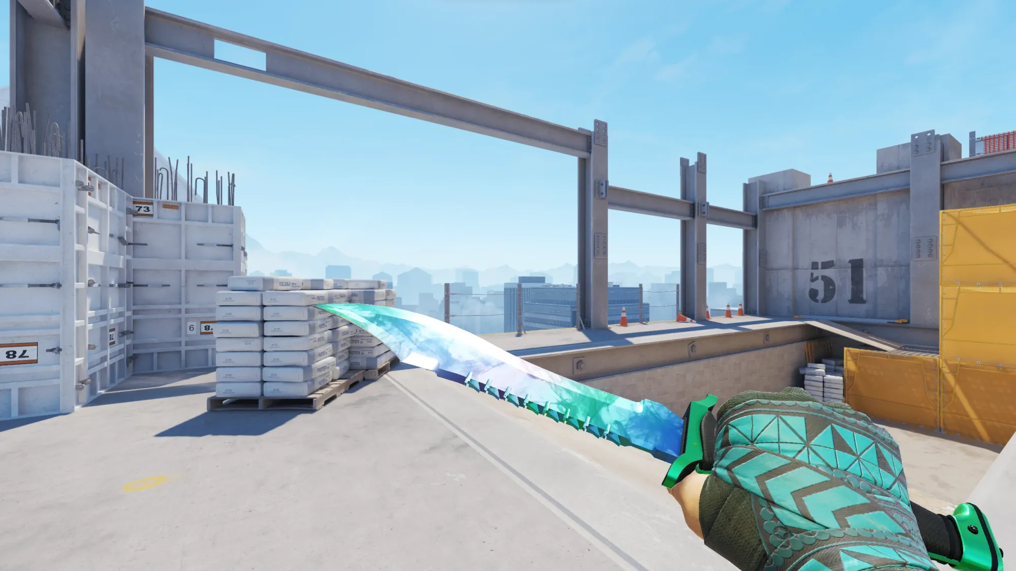 In-game image showing a CS2 knife and glove combo, highlighting the matching colors and patterns of the weapon and gloves.