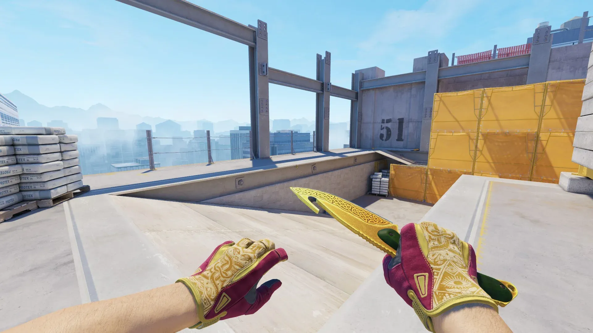 CS2 loadout showcasing the Gut Knife Lore with a gold ornamental blade alongside Sport Gloves Occult featuring a yellow and pink design with detailed golden patterns