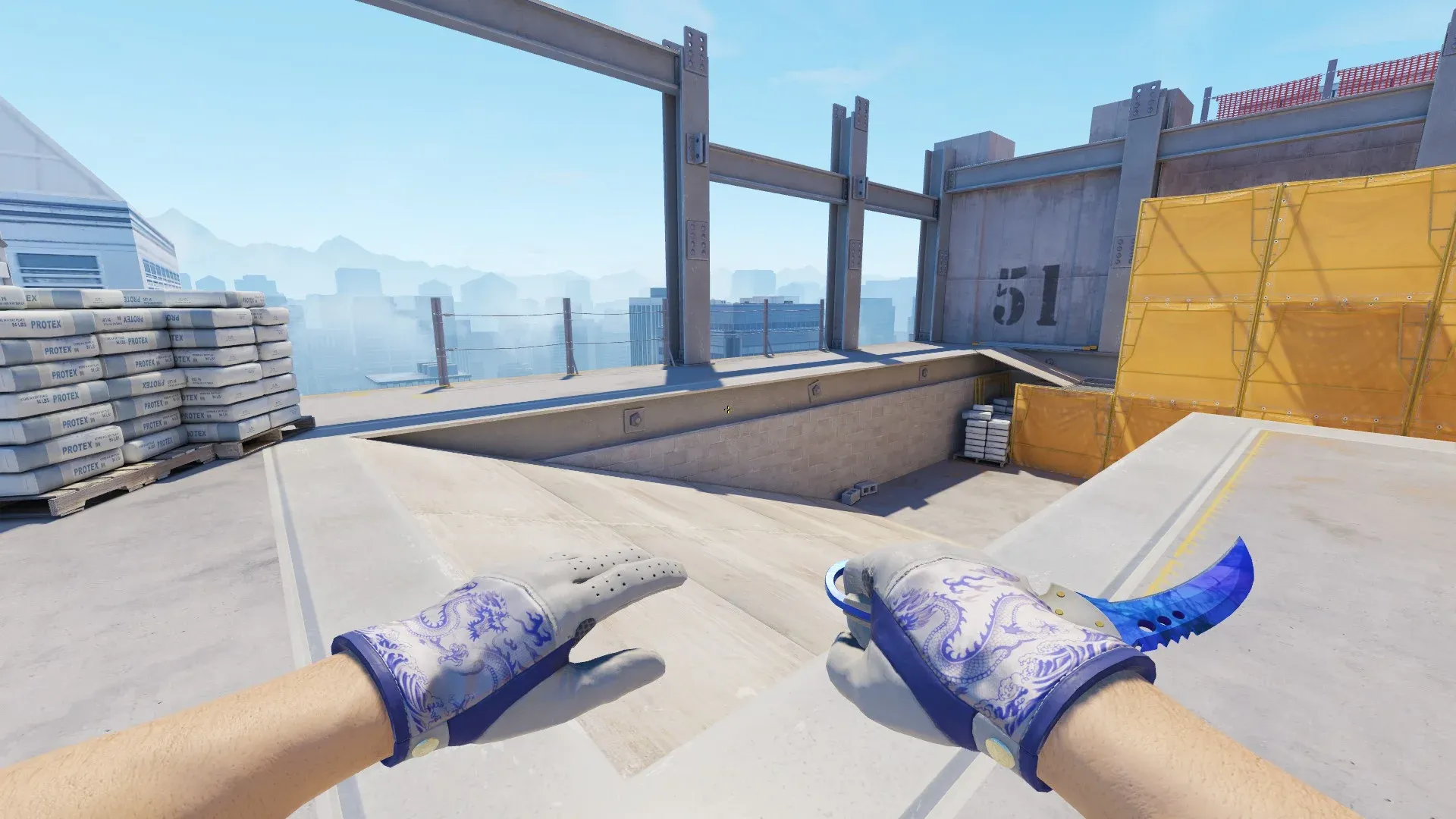 CS2 loadout showcasing the Talon Knife Doppler Sapphire with a deep blue curved blade alongside Driver Gloves Wave Chaser featuring a white leather design with blue dragon patterns