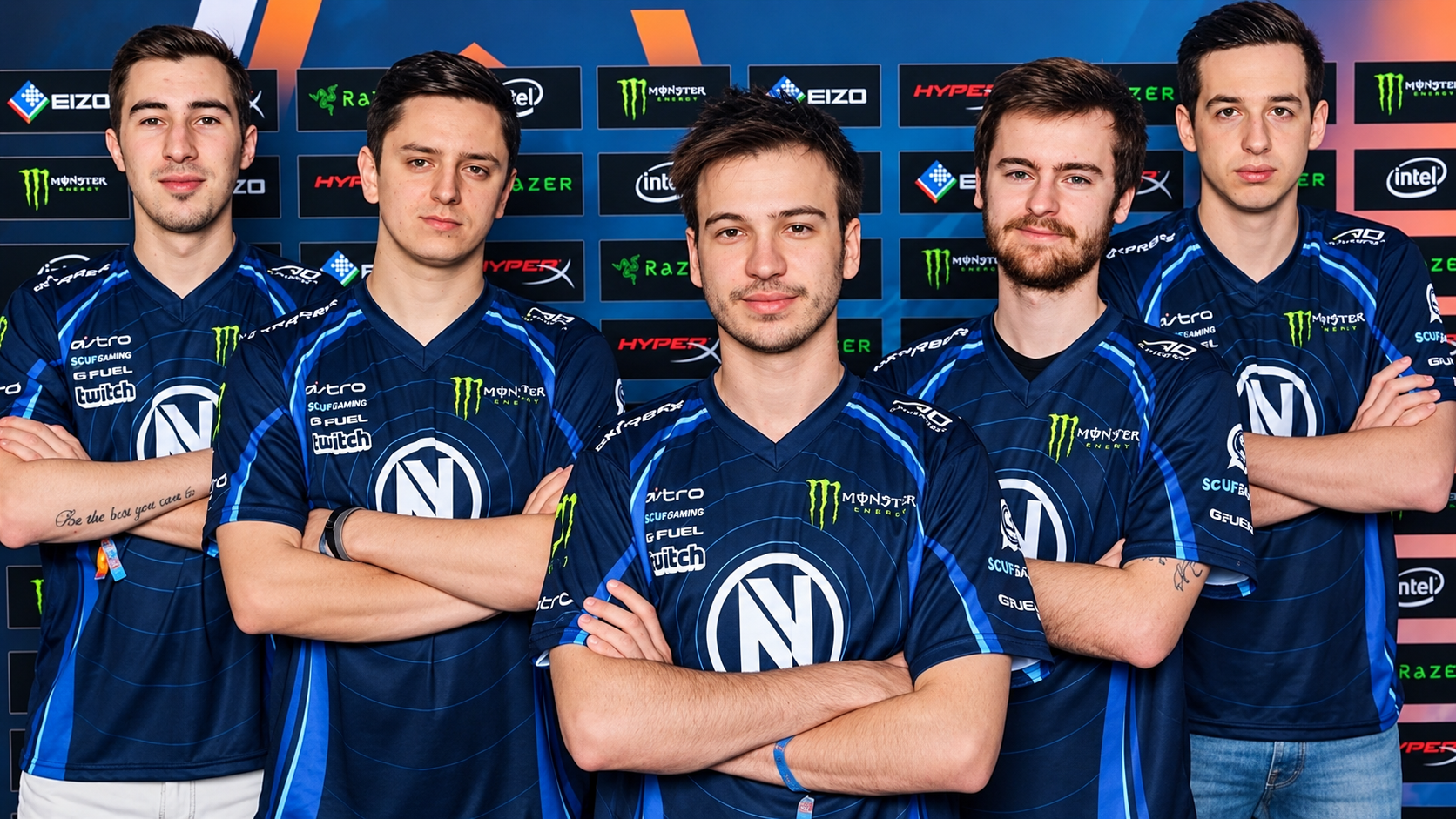 Esports players kennyS, apEX, Happy, kioShiMa, and NBK- wearing matching blue Team Envy jerseys posing with arms crossed against a sponsor background.   