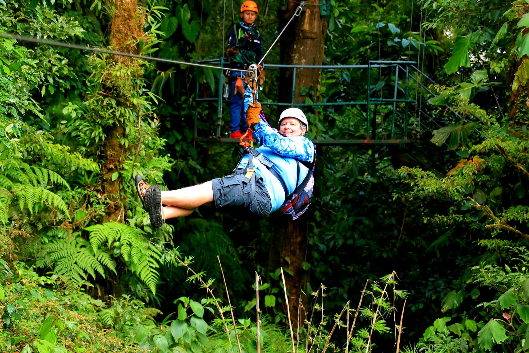 Mid-flight through the jungle on a Sepultura zipline.