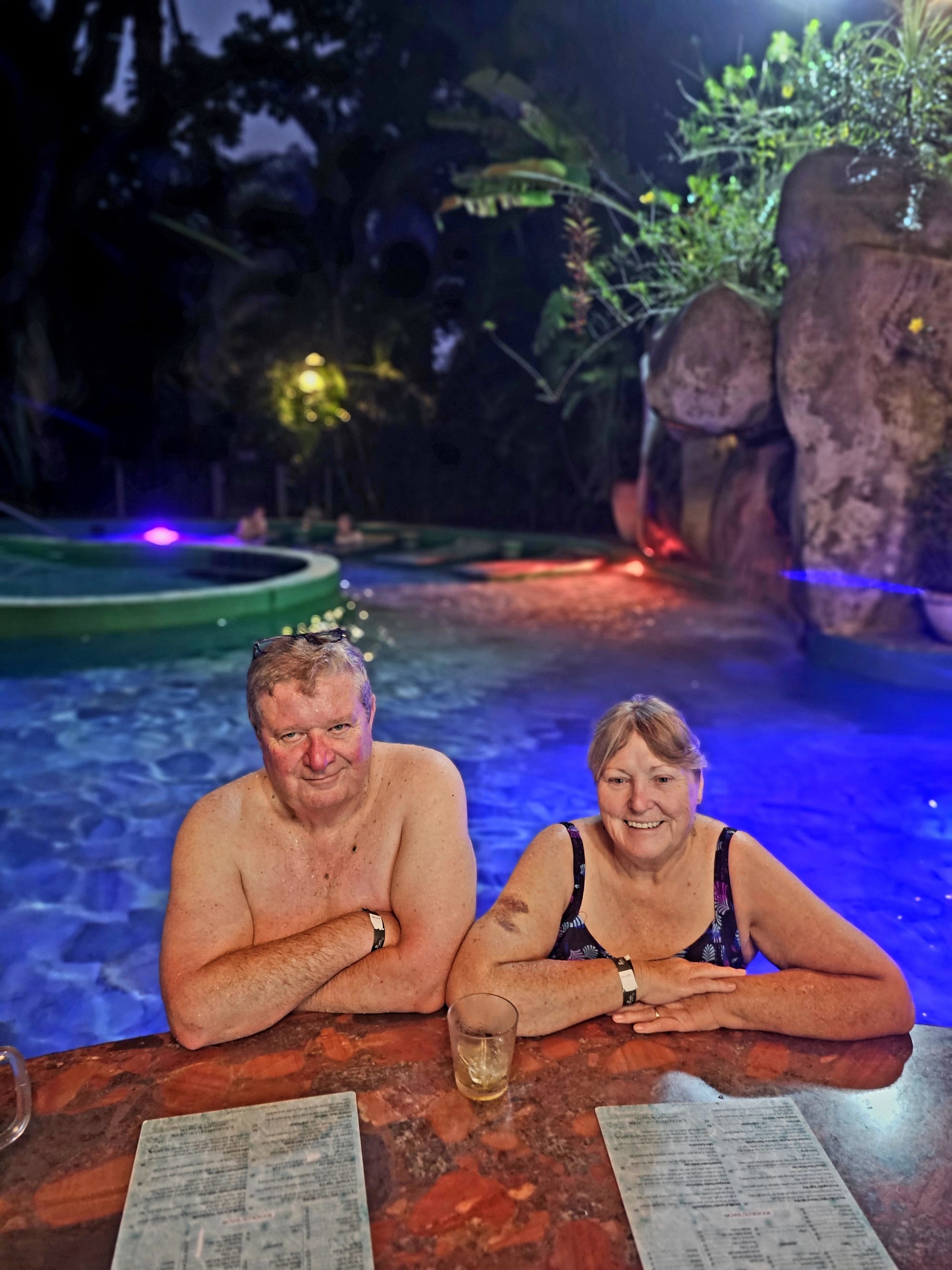 Paradise Hot Springs — an evening soak under the lights, warm pools easing tired legs after full days around Arenal.