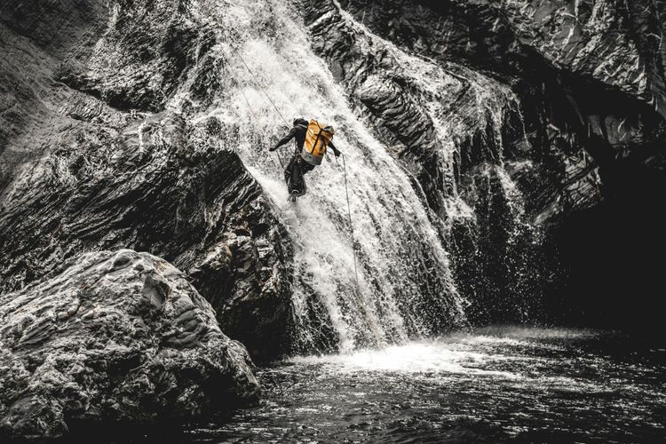 Descending through a roaring waterfall — where adventure, courage, and nature’s power meet
