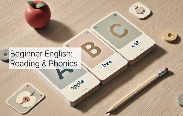 Flashcards showing "A - Apple," "B - Bee," and "C - Cat" arranged on a table with a pencil and scattered cards. A banner reads "Beginner English: Reading & Phonics." 