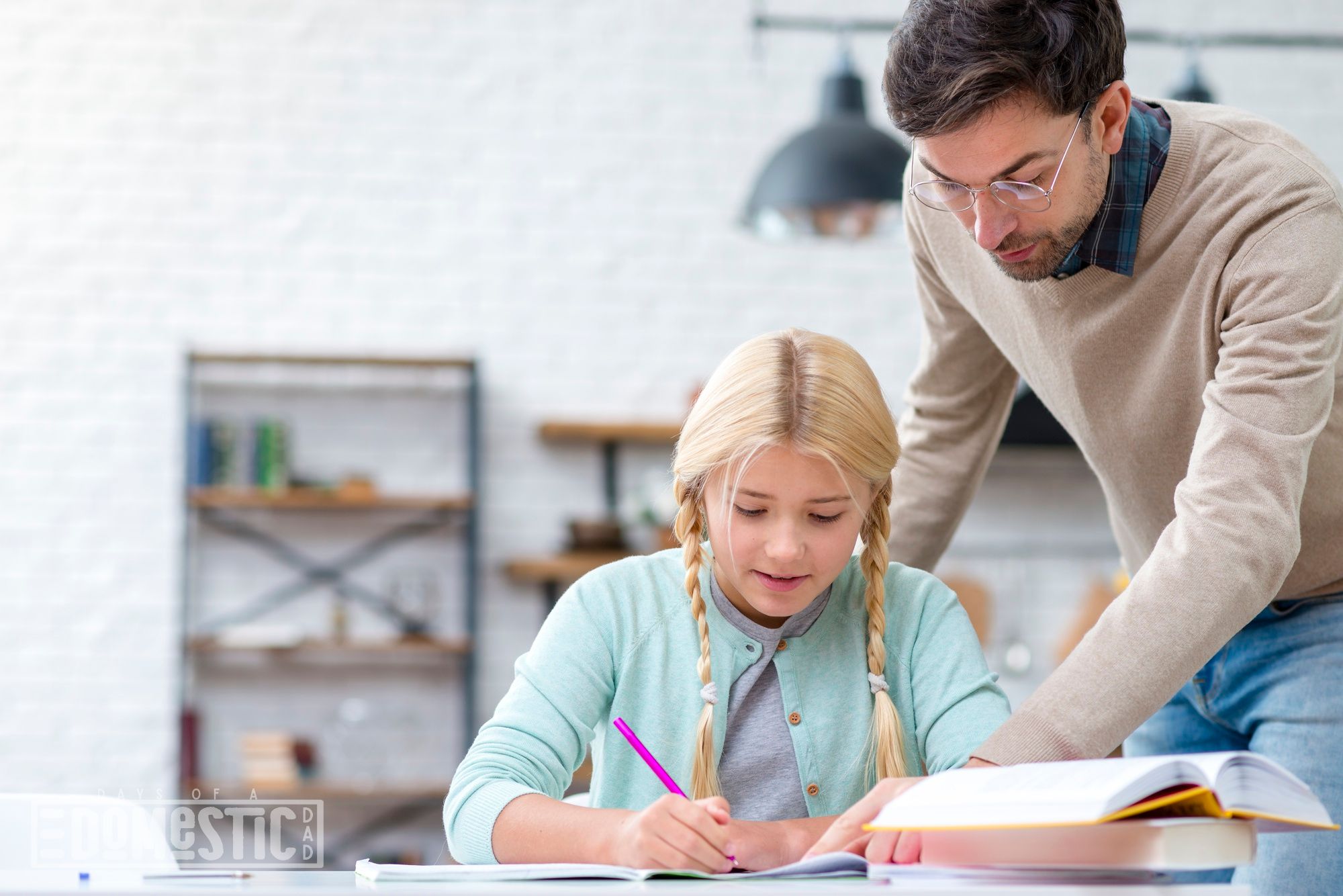 Father and daughter doing homework
