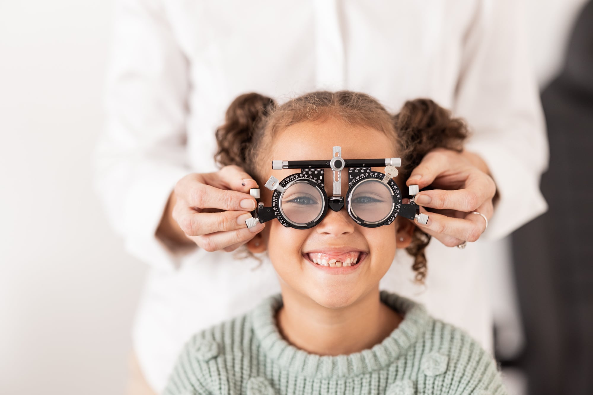 Vision, optometrist and portrait of child with glasses to test, check and examine eyesight. Healthcare, medical and young girl in doctor office for eye examination, optical diagnostic and examination.