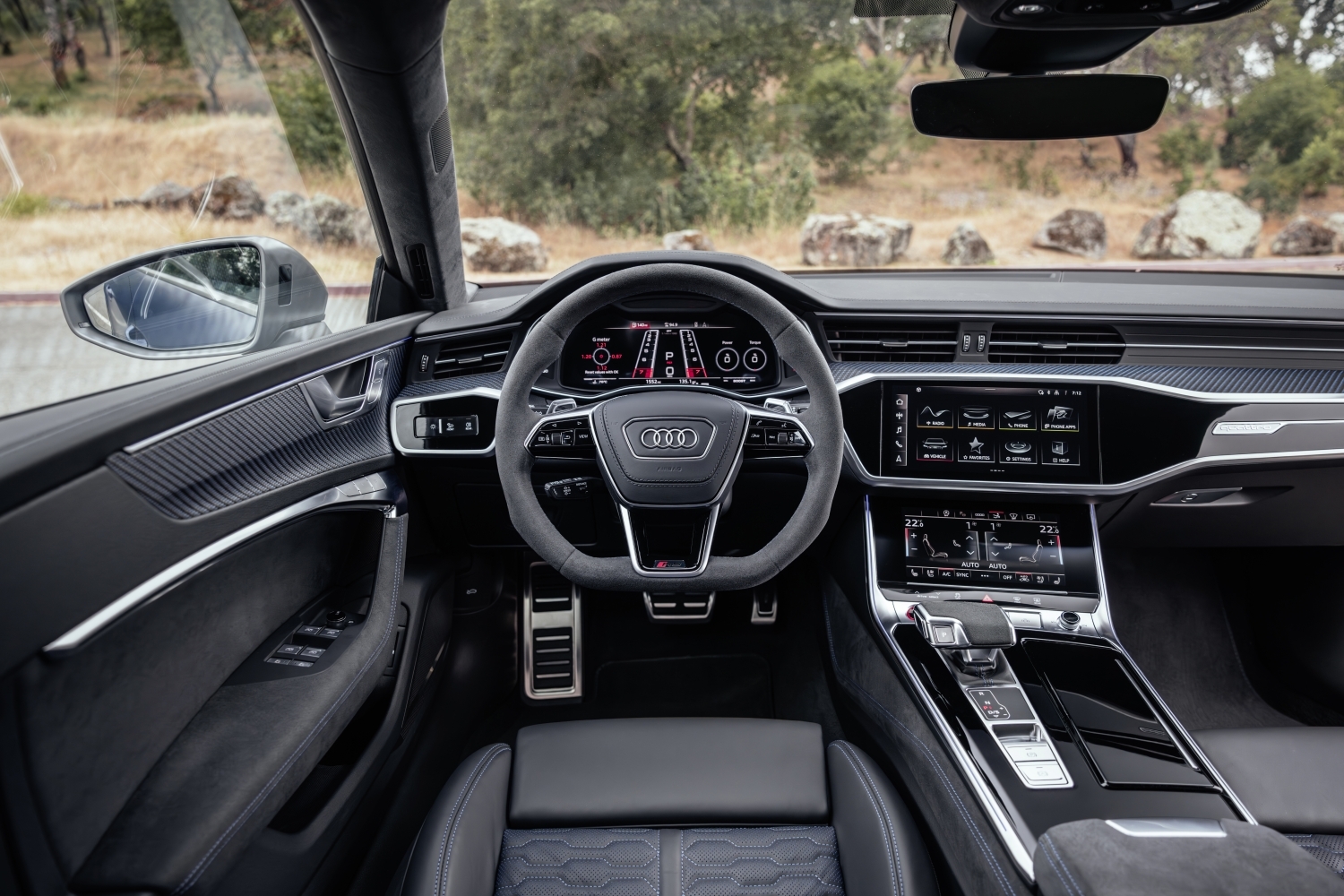 Audi RS e-tron interior showing digital cockpit, steering wheel, and dashboard design