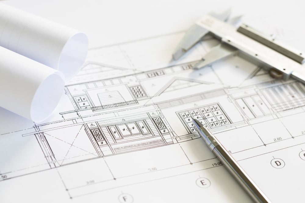 construction plans and drawing tools on blueprints