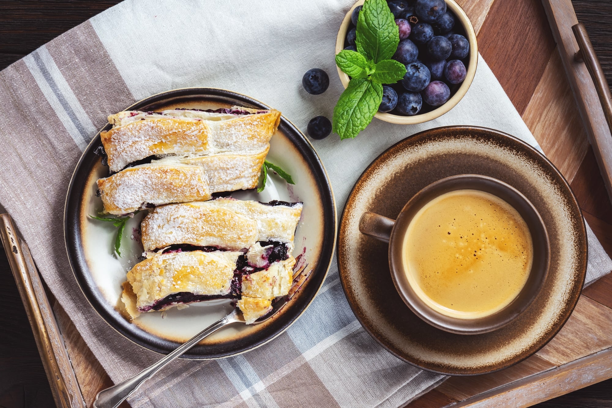 Homemade mixed berry strudel, on wooden tray