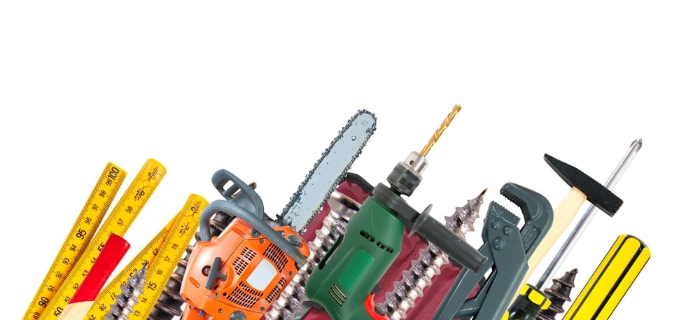 Border from set of different tools over white