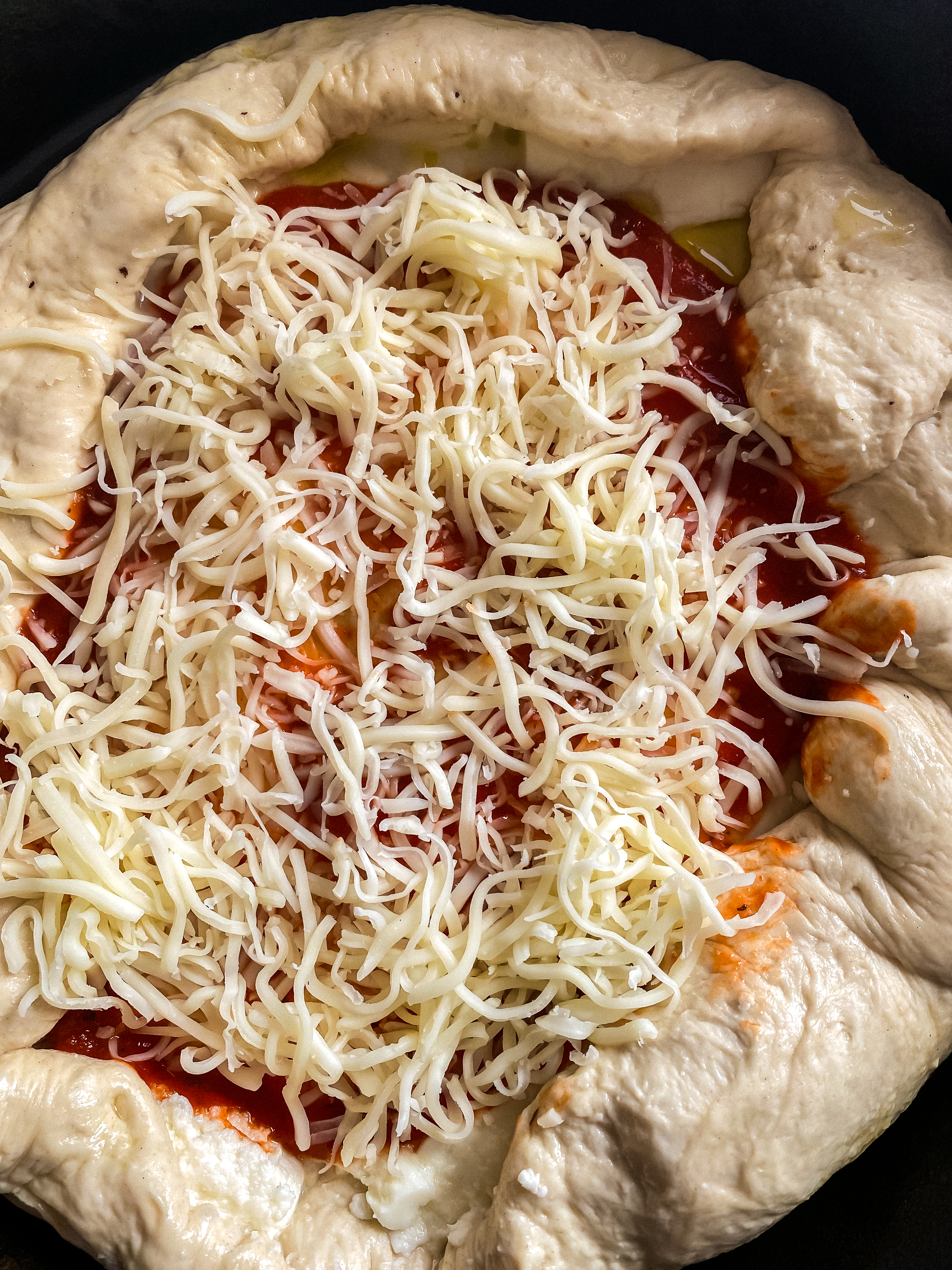 Adding cheese to a Pizza sauce - Stuffed Crust Cast Iron Pizza