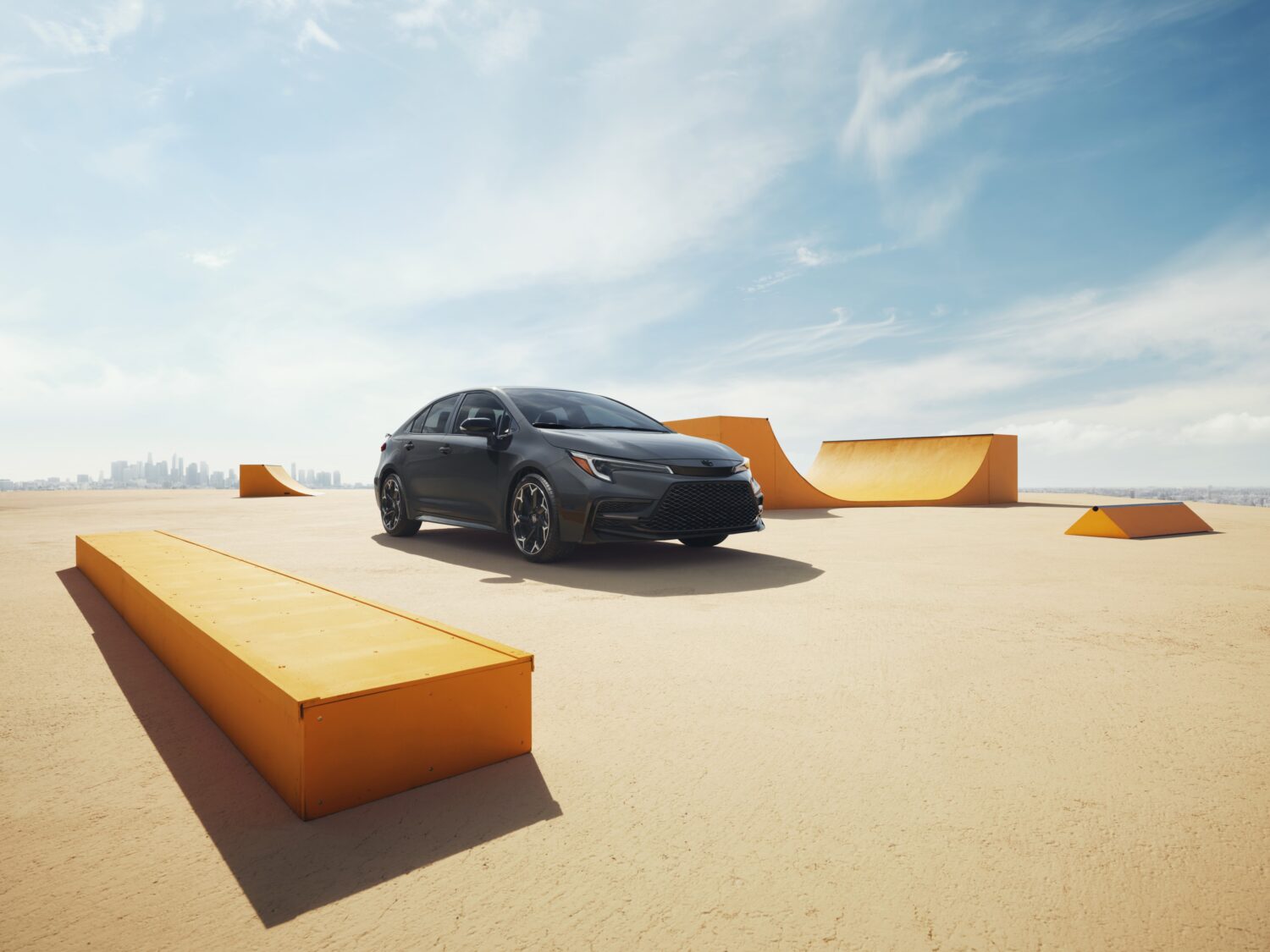 Front view of the 2025 Toyota Corolla FX with sporty design in an urban setting