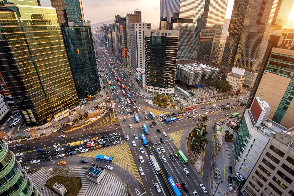Traffic speeds through an intersection in gangnam, seoul in south korea