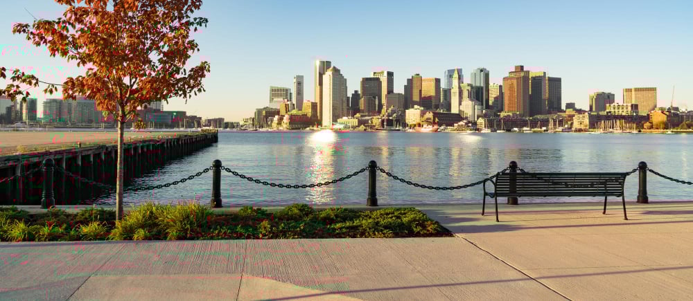 View across boston harbor to the boat traffic fronting the downtown city skyline