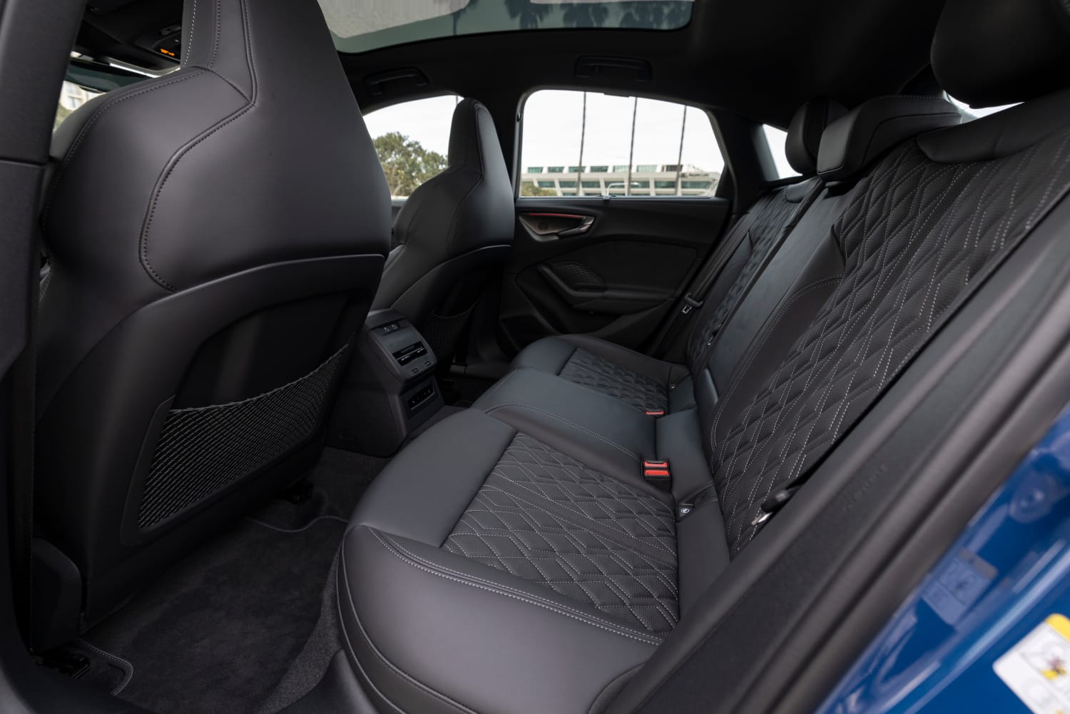 A shot of the rear seats in the 2026 Audi S5, highlighting the extra inch of legroom from the longer wheelbase.