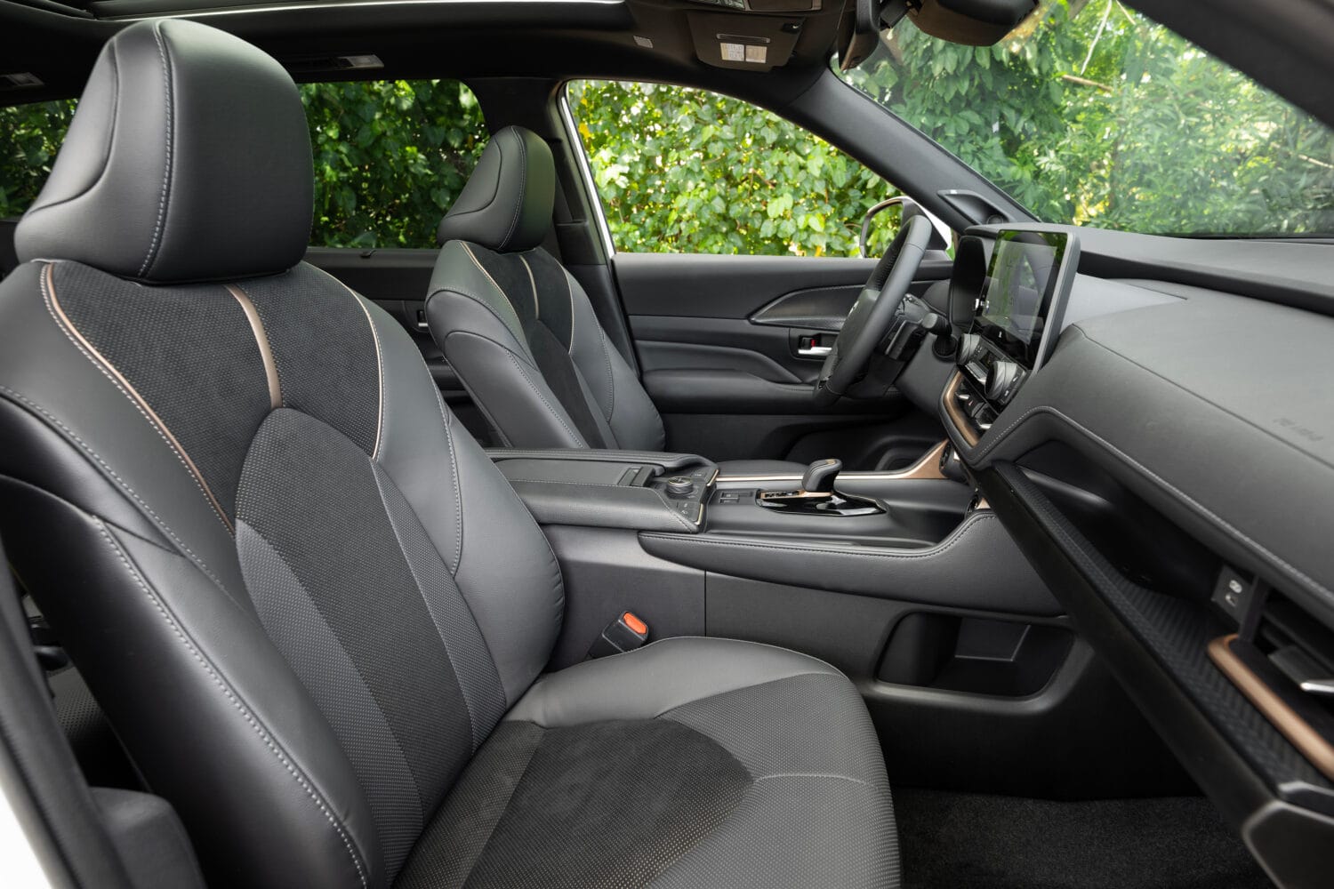 Front seats and center console inside the 2026 Toyota Grand Highlander Hybrid MAX Platinum interior
