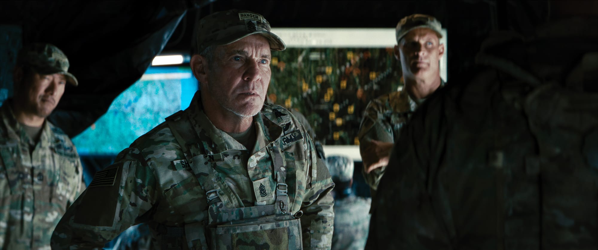 Military officers discussing mission strategy in the Netflix sci-fi war movie War Machine