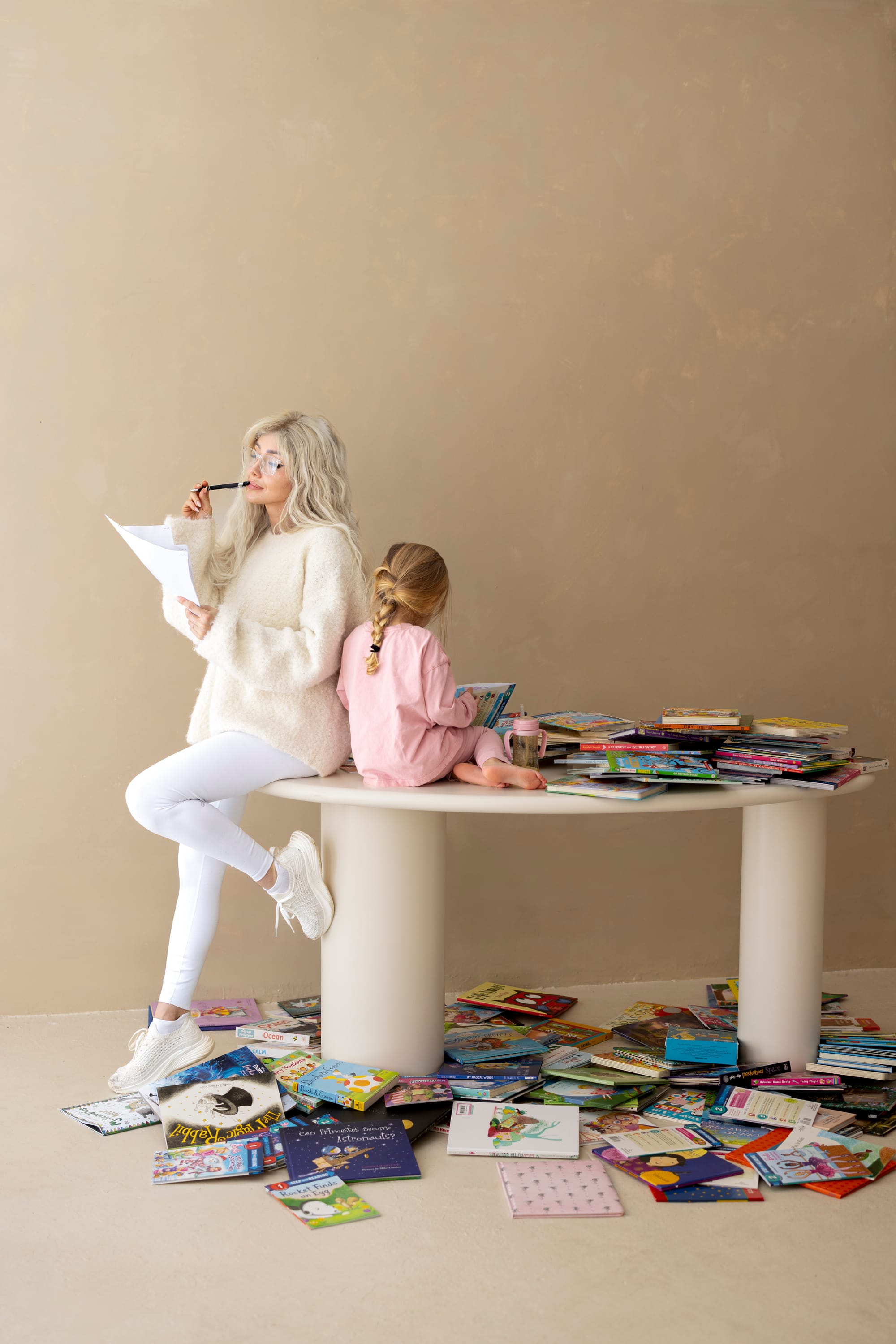 Author Michelle Grace with her daughter surrounded by children's books