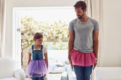 father dressing up with teen daughter