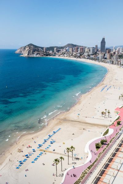 Hotels and beach of benidorm. sky and sea. photo.