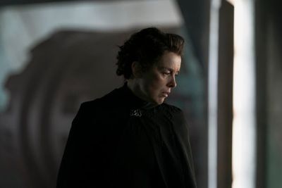 Olivia Williams as Tula Harkonnen, appearing in a moment of deep thought or inner conflict. The moody lighting and shadowed b
