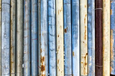 Wall with various thick shabby pipes