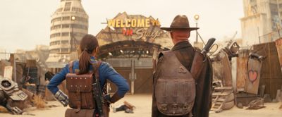 Fallout parents guide scene showing Lucy and the Ghoul approaching the Strip in the post-apocalyptic wasteland