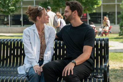Olive and Adam kiss in a scene from The Love Hypothesis movie.
