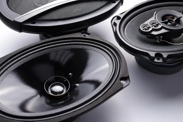 Photo black car sound speakers closeup on a white background audio system hard bass subwoofer