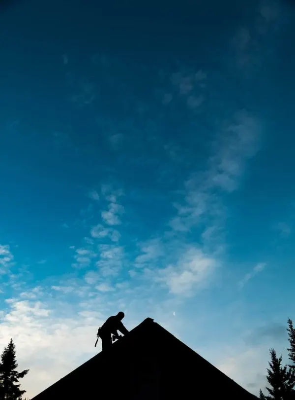contract worker fixing a home roof