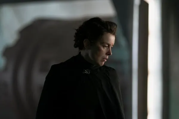 Olivia Williams as Tula Harkonnen, appearing in a moment of deep thought or inner conflict. The moody lighting and shadowed b