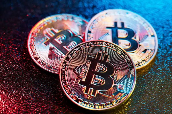 bitcoin coins in a colorful lighting cryptocurrency and cryptography virtual currency