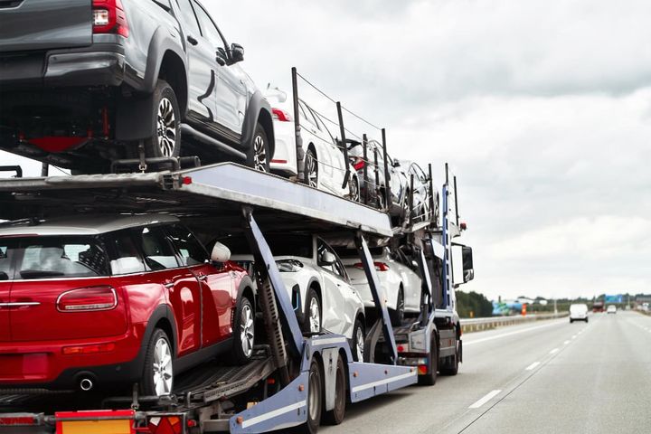 Tow truck at work On an open road under the vast sky lies the silent tale of a car s breakdown and the timely arrival of help