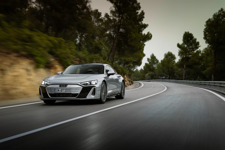 Audi RS e-tron GT front view driving on a mountain road curve