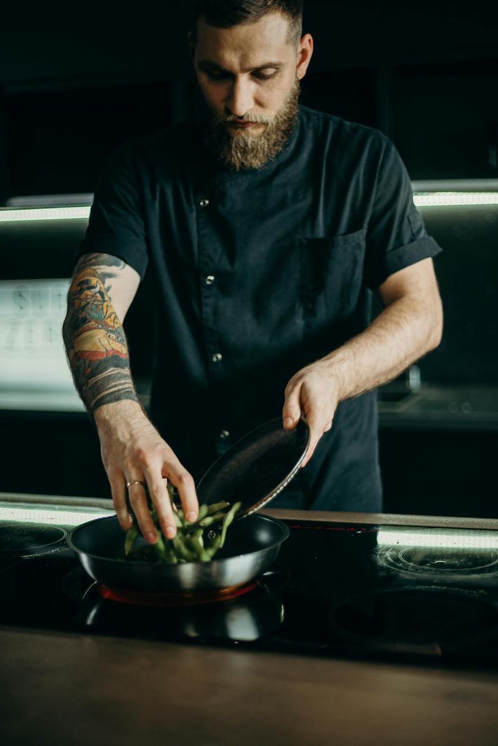 Man Cooking A Dish