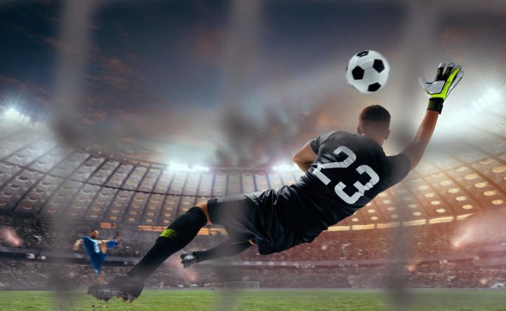 soccer players in action on professional stadium