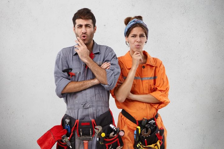 Unhappy plumbing specialists have displeased expression