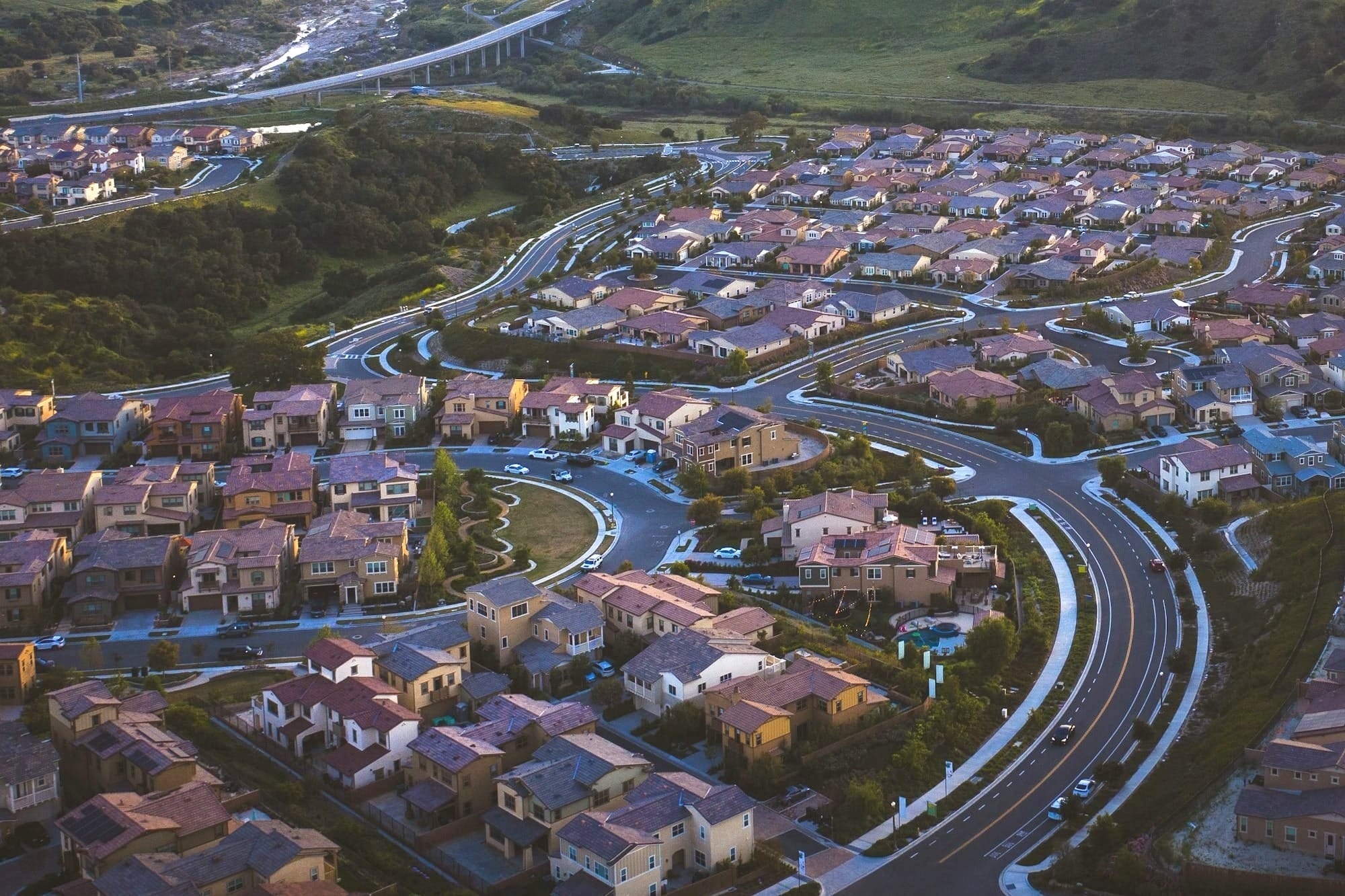 top view of cityscape under cloudy sky