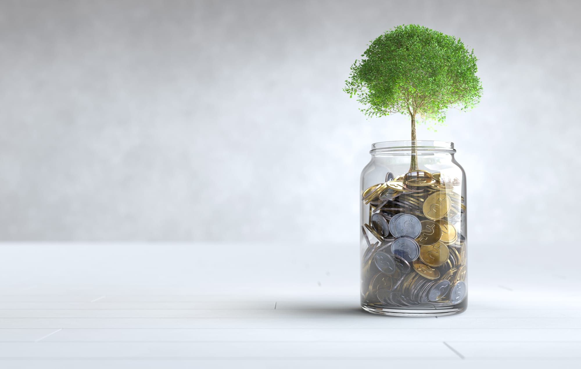 Coins growing out of a glass jar. An illustration of how investing works. Image source - freepik.