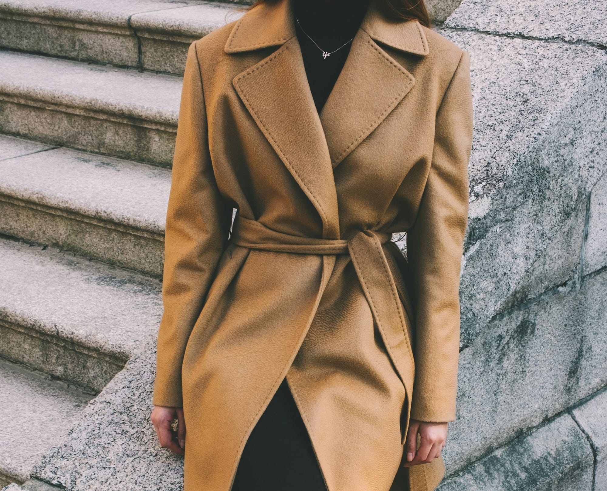 woman wearing brown notched lapel coat