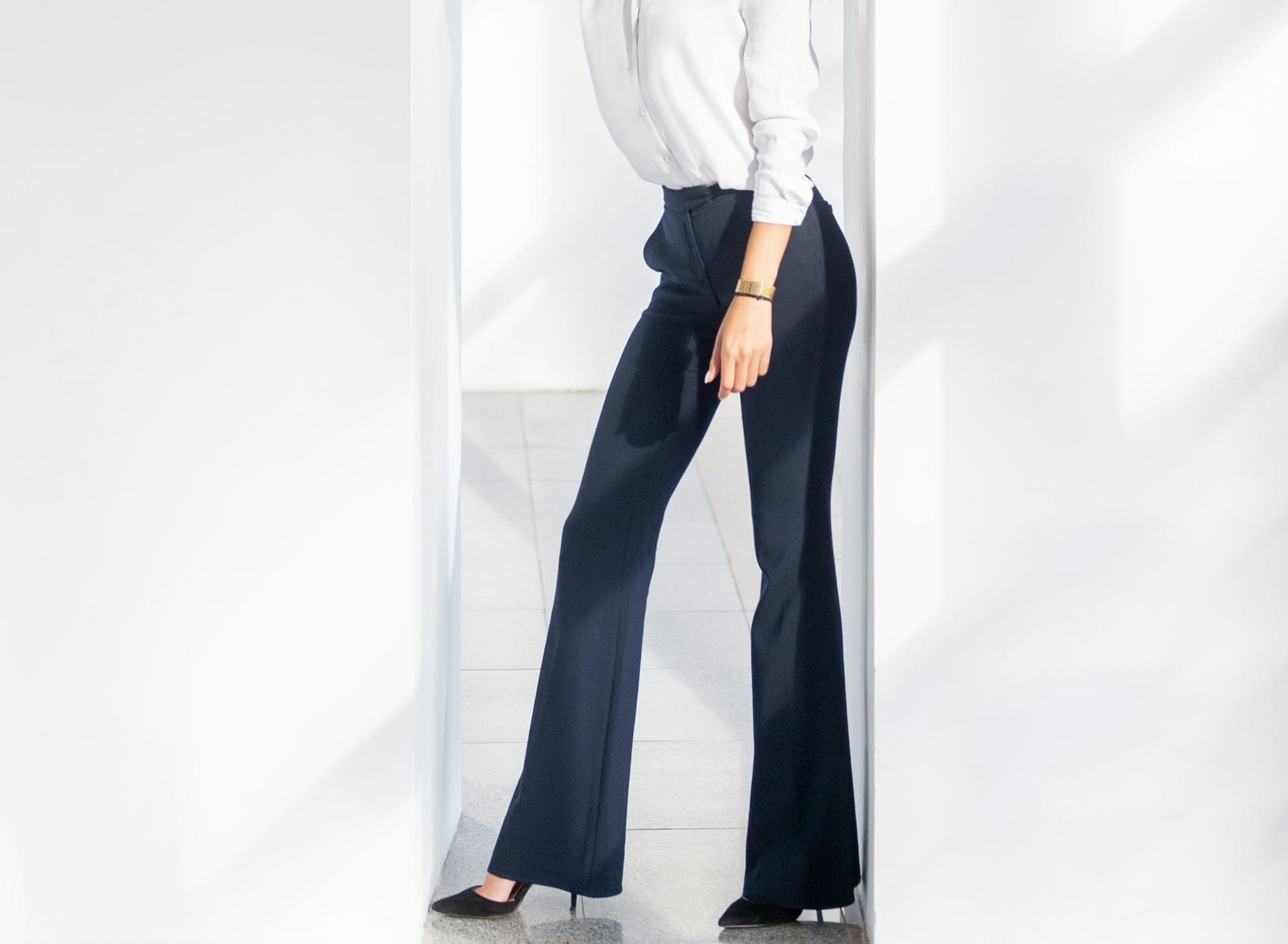 woman in tailored trousers pants