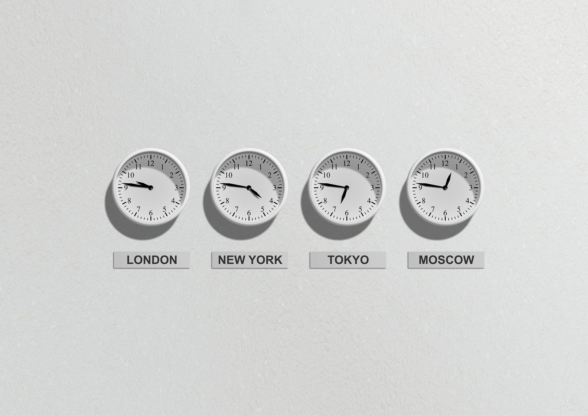 Photo of clocks set to different timezones