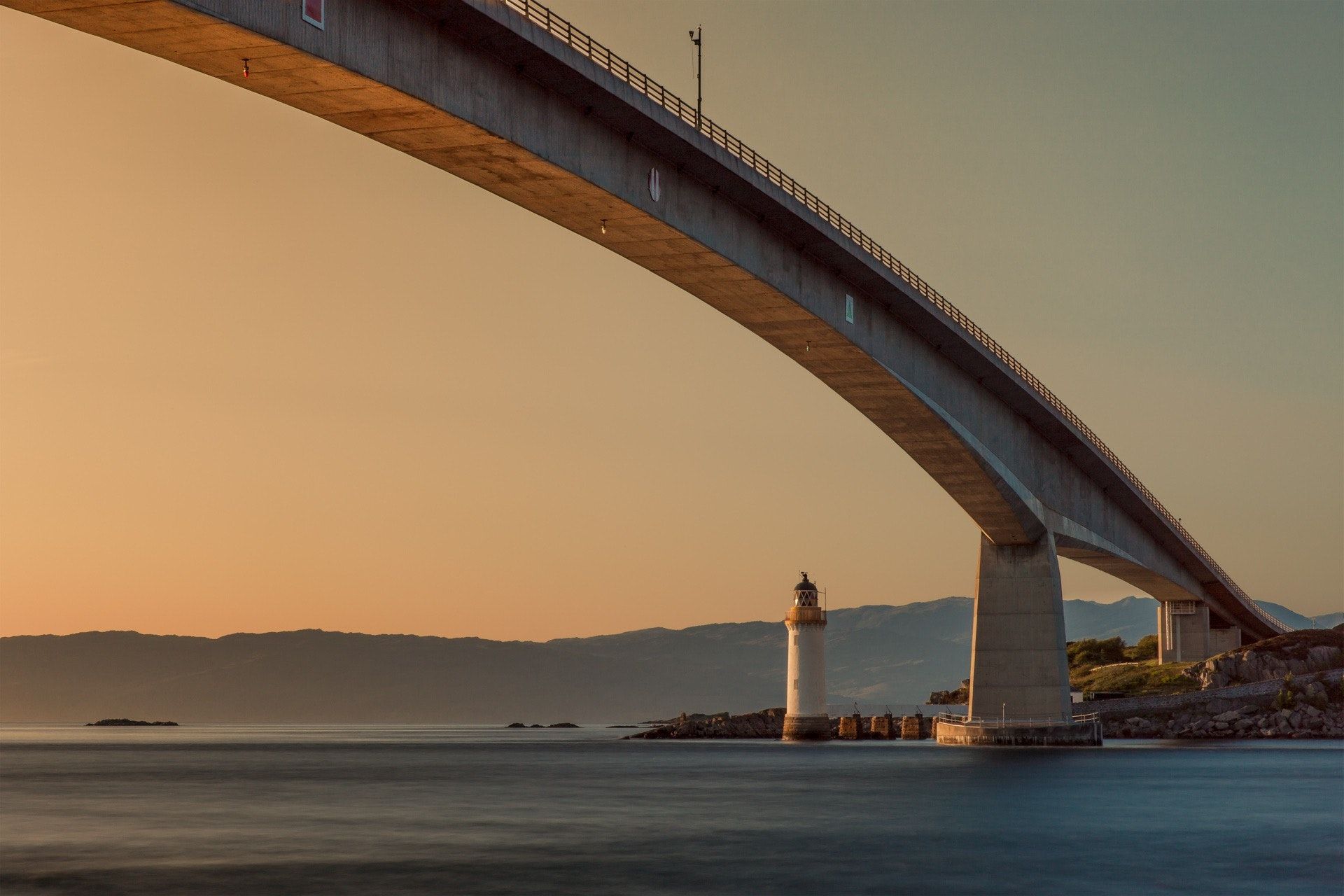 A photo of a bridge spanning two shores and so making it possible to travel between them