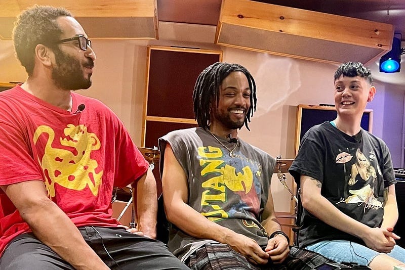 Already Late band members in candid moment during Peatix interview discussing their musical journey.